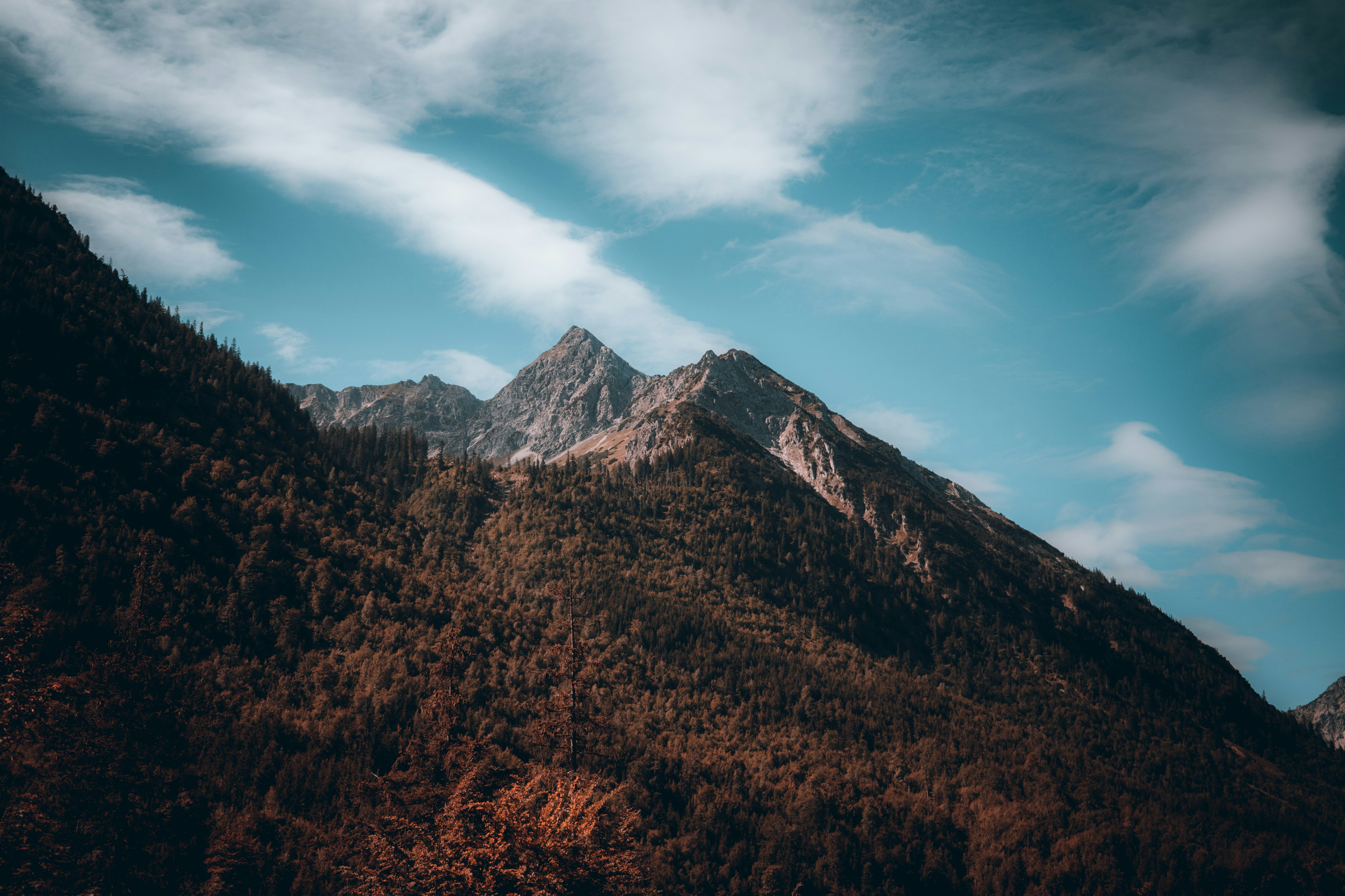 brown and green mountains under blue sky during daytime